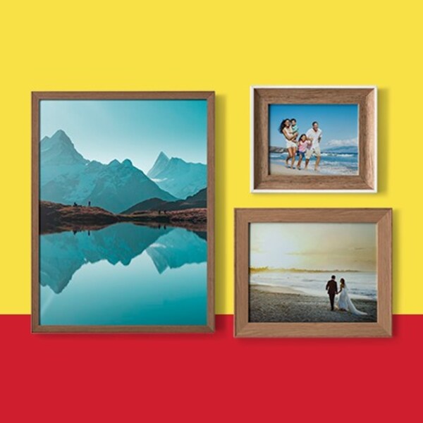 three brown frames on yellow and red background